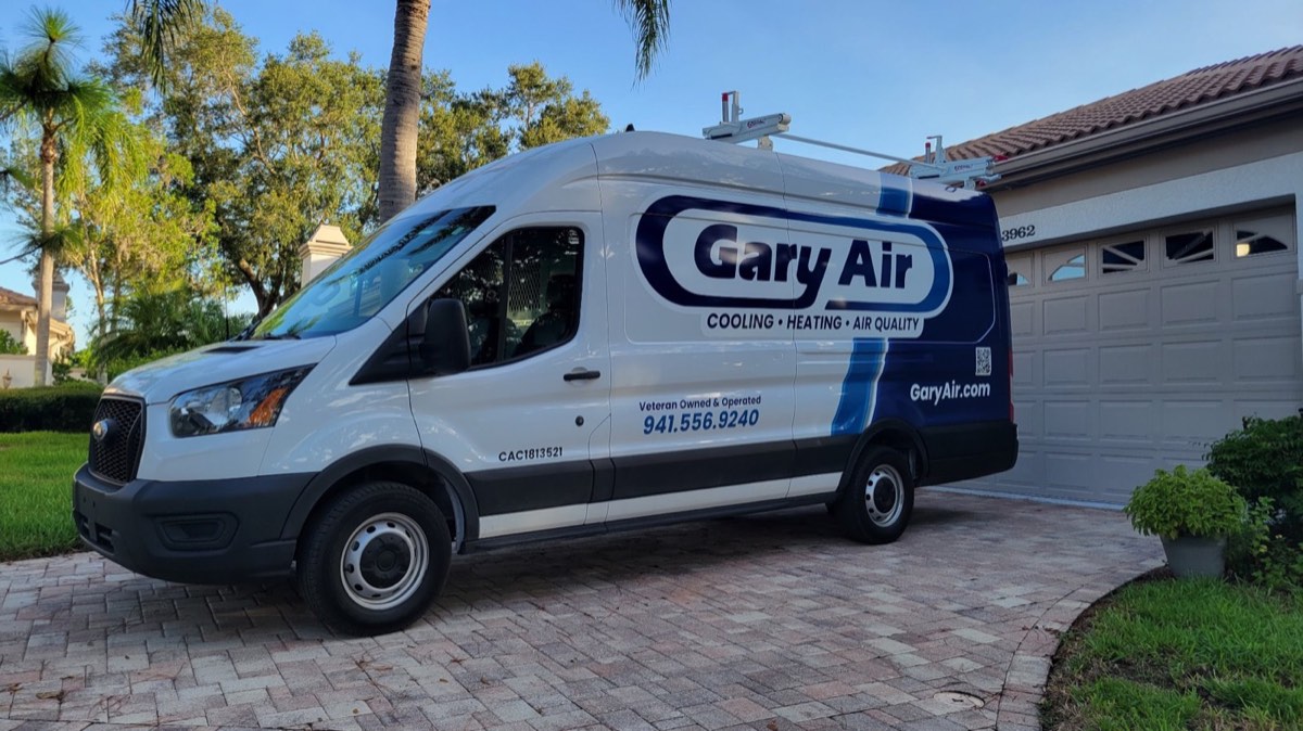 Gary Air branded service van parked in the driveway of a Sarasota home